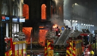 Floors collapse inside the building as fire fighters work at the site of a large fire in Glasgow City centre on March 8, 2026. (Photo by Andy Buchanan / AFP)