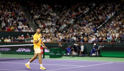 Carlos Alcaraz of Spain celebrates a point against Arthur Rinderknech of France in their third-round match of the BNP Paribas Open at Indian Wells Tennis Garden on March 09, 2026 in Indian Wells, California. Photo by Clive Brunskill/ AFP)