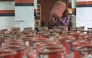 A  delivery staff carries liquefied petroleum gas (LPG) cylinders at a distribution centre in Amritsar on March 10, 2026. (Photo by Narinder Nanu / AFP)