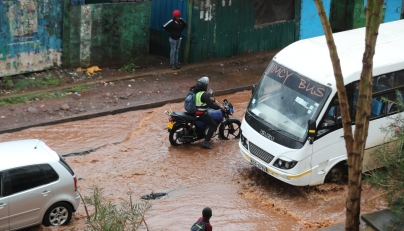 Vehicles move on a flooded road after a heavy rain in Kibera of Nairobi, Kenya, on March 7, 2026. (Photo by Henry Naminde/Xinhua)