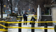 Toronto Police officers work around the scene of a shooting at the US Consulate in Toronto, Canada, on March 10, 2026. (Photo by Cole BURSTON / AFP)
