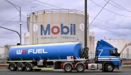 A fuel tanker passes the Mobil fuel distribution centre in the Melbourne suburb of Yarraville on March 12, 2026 as the demands and prices of petrol and diesel soar due to the Middle East conflict.  (Photo by William West / AFP)