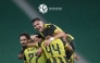 Qatar SC's Mus’ab Al Battat celebrates with teammates. 