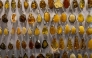 This photo shows jewellery made from natural Baltic amber, on sale at an amber shop on Mariacka Street in Gdansk, Poland on March 10, 2026. (Photo by Wojtek RADWANSKI / AFP)