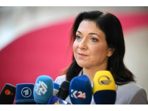 Germany's Economy and Energy Minister, Katherina Reiche speaks to the media as she arrives for a Transport, Telecommunications and Energy Council in Brussels on March 16, 2026. (Photo by NICOLAS TUCAT / AFP)