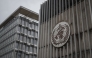 This photograph shows a logo of the World Health Organisation (WHO) displayed on the facade of organisation's headquarters in Geneva on April 23, 2025. Photo by Fabrice COFFRINI / AFP