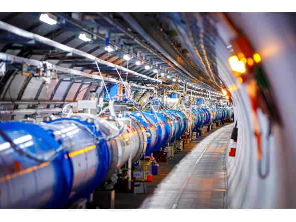 TOSome of the 1232 dipole magnets that bend the path of accelerated protons are pictured in the Large Hadron Collider (LHC) in a tunnel of the European Organisation for Nuclear Research (CERN), during maintenance works on February 6, 2020 in Echenevex, France, near Geneva. Photo by VALENTIN FLAURAUD / AFP