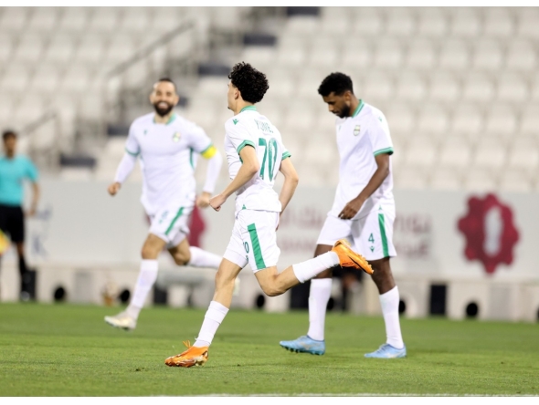 Al Ahli's Younis Abdelrahman (centre) celebrates after scoring a goal against Al Gharafa yesterday.