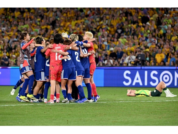 Japan's players celebrate winning the final of the AFC Women Asian Cup Australia 2026 football tournament between Australia and Japan at Stadium Australia in Sydney on March 21, 2026. (Photo by Saeed Khan / AFP)