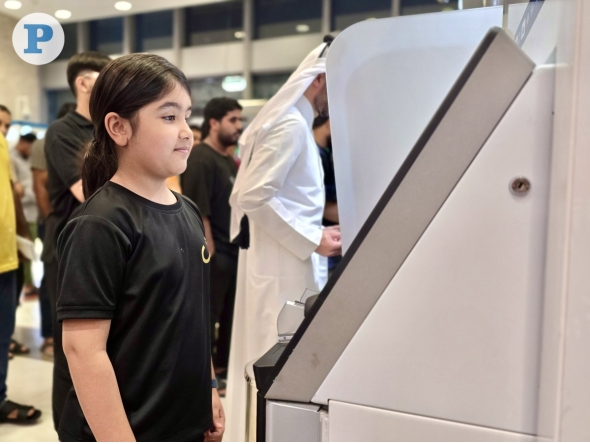 File photo of a child withdrawing Eidi at Eidiya ATMs during Eid Al Fitr 2026. 