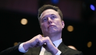 (Files) Elon Musk looks on at the John F. Kennedy Center for the Performing Arts in Washington, DC on November 19, 2025. (Photo by Brendan Smialowski / AFP)