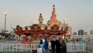 Families mark the second day of Eid al-Fitr at Doha Corniche, Souq Waqif, and Al Masrah park in Qatar. Photos by AFP