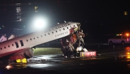 An Air Canada Express plane sits on the tarmac after it collided with a fire truck on the tarmac at LaGuardia Airport on March 23, 2026 in New York City. The plane had landed from a flight from Montreal. Spencer Platt/Getty Images/AFP 