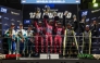 Team Qatar drivers celebrate their victory on the podium.