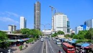 Commmuters wait for public transport along a deserted road in Colombo on March 18, 2026. Photo by Ishara S. Kodikara / AFP
