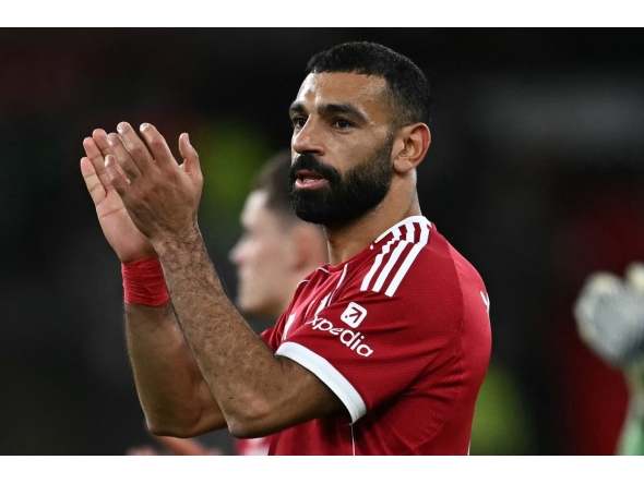 (FILES) Liverpool's Egyptian striker #11 Mohamed Salah applauds the fans following the English Premier League football match between Liverpool and Aston Villa at Anfield in Liverpool, north west England on November 1, 2025.  (Photo by Paul ELLIS / AFP)