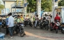 People queue to refuel at a petrol station in Hyderabad on March 25, 2026. Photo by NOAH SEELAM / AFP