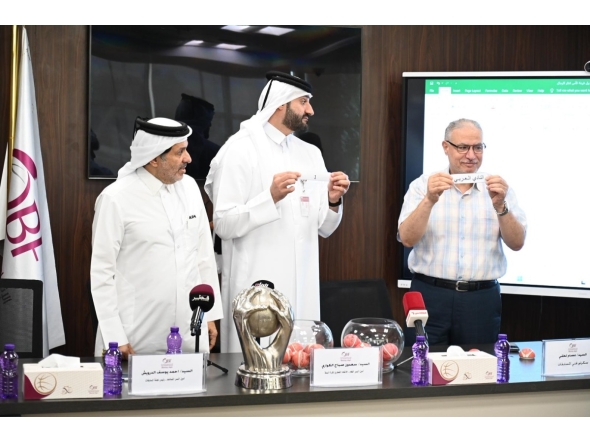 Officials pick teams during the draw ceremony for the 13th Qatar Cup basketball tournament.