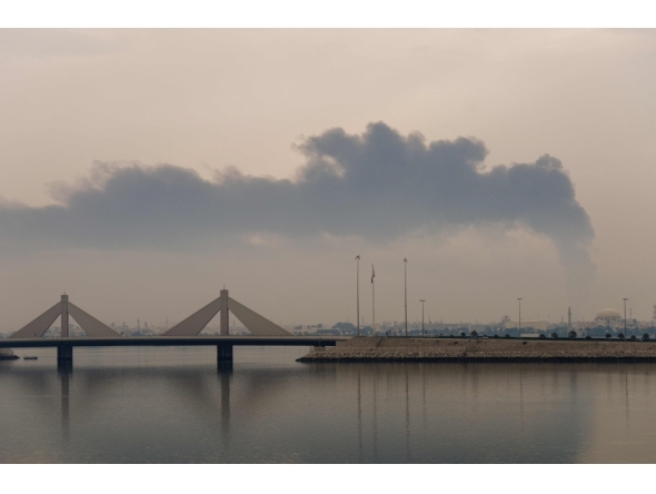 (Files) A plume of smoke rises after a reported Iranian strike on fuel tanks in Muharraq on March 12, 2026. (Photo by Fadhel Madhan / AFP)