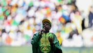 Sengalese musician Youssou N'Dour performs ahead of the international friendly football match between Senegal and Peru at the Stade de France in Saint-Denis, north of Paris on March 28, 2026. (Photo by Julien De Rosa / AFP)