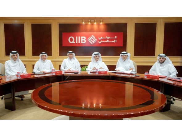 Chairman of the Board of Directors of QIIB Sheikh Dr. Khalid bin Thani bin Abdullah Al-Thani, CEO of QIIB Dr. Abdulbasit Ahmed A Al-Shaibei with other officials during the Ordinary General Assembly meeting.