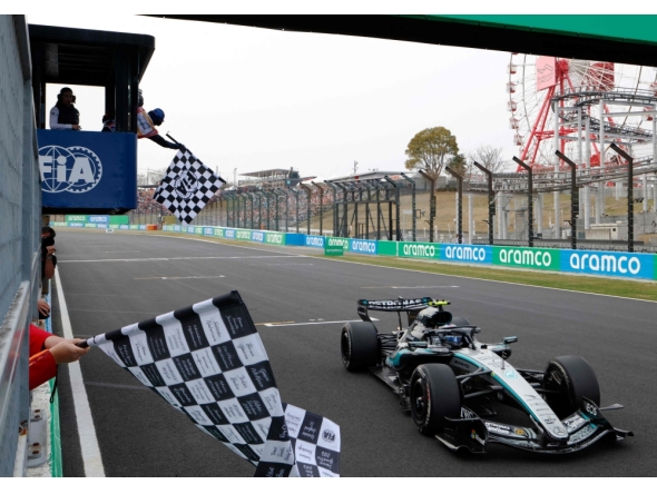 Mercedes' Italian driver Kimi Antonelli crosses the finish line to win the Formula One Japanese Grand Prix at the Suzuka circuit in Suzuka, Mie prefecture on March 29, 2026. (Photo by Franck Robichon / Pool / AFP)