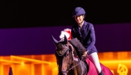 Cyrine Cherif celebrates astride Triple T Calamando Blue.
