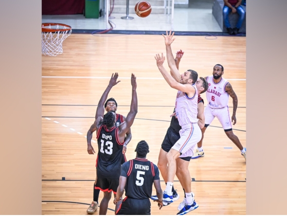 Al Arabi's Elmedin Kikanovic (third right) shoots to score.