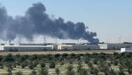 Smoke rises from an area of Kuwait's international airport after a reported drone strike on April 1, 2026. (Photo by AFP) 