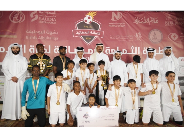 Al Wajba players celebrate with the trophy. Chairman of the Organising Committee Hassan Ali Al Ishaq and Tournament Director Youssef Ali Abdul Noor are also present.   