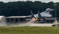 This handout photo provided by the US Air Force shows an F-15E Strike Eagle taking off for a training sortie at Seymour Johnson Air Force Base, North Carolina, on August 22, 2025. (Photo by Master Sgt. Alexandre Montes / US AIR FORCE / AFP)