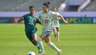 Xie Zongmei (R) of China vies with Sauravi Akanda Prity of Bangladesh during the group A match between China and Bangladesh in the 2026 AFC U20 Women's Asian Cup in Nonthaburi, Thailand (Rachen Sageamsak / Xinhua)