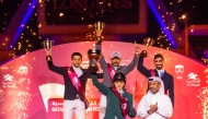 Overall One-Star champion of the Doha Equestrian Tour 2026 Saad Al Saad (back, centre) celebrates with other outstanding riders of the season, along with Member of the Doha Equestrian Tour 2026 Organising Committee and the Al Shaqab Board of Directors Rashid Nasser Saree Al Kaabi.