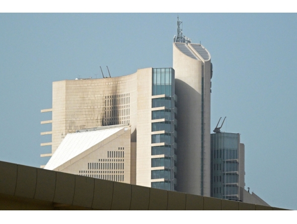 This photograph shows the impact of a fire caused by a drone attack on a building of the Kuwait Petroleum Corporation (KPC), in Kuwait City on April 5, 2026. (Photo by AFP)
