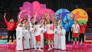 Second Vice President of the Qatar Olympic Committee Dr. Thani bin Abdulrahman Al-Kuwari, and Qatar Handball Federation President Ahmed Mohammed Al-Shaabi applaud as Al Arabi players celebrate their triumph.