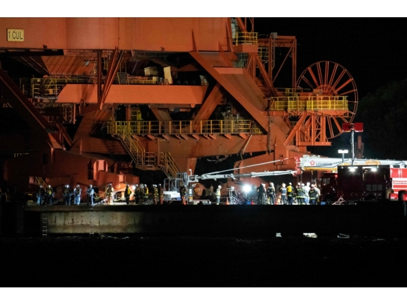 Emergency workers are seen at the JFE Steel East Japan Works Keihin District construction site, where scaffolding collapsed in Kawasaki, Kanagawa prefecture on April 7, 2026. (Photo by Yuichi Yamazaki / AFP)