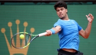 Spain’s Carlos Alcaraz plays a forehand return to Argentina’s Sebastian Baez.