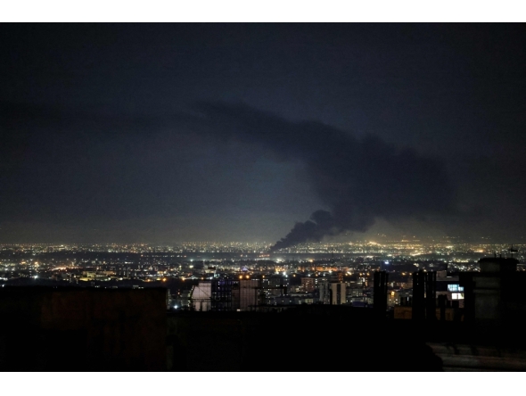 Smoke rises from the site of a US-Israeli strike on the Iranian capital Tehran on April 7, 2026. (Photo by Atta Kenare / AFP) 