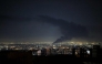 Smoke rises from the site of a US-Israeli strike on the Iranian capital Tehran on April 7, 2026. (Photo by Atta Kenare / AFP) 