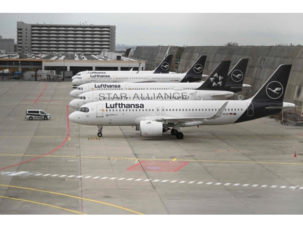 Planes operated by German airline Lufthansa sit on the tarmac at Frankfurt Airport in Frankfurt am Main, on April 10, 2026 as cabin crews went on strike over an ongoing labour dispute. (Photo by Kirill KUDRYAVTSEV / AFP)