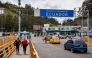 (Files) Vehicles and people cross the Rumichaca International Bridge on the Colombia-Ecuador border, in Ipiales, Narino department, Colombia, on January 21, 2026. (Photo by Reicarmyr Canizares / AFP)