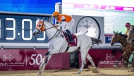 Alberto Sanna and Mutamarrid cross the finish line to win Al Mamoura Cup at Al Rayyan Racecourse. 