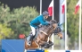 Saudi Arabian rider Abdullah Alsharbatly guides Frenchy Vds over a fence. 