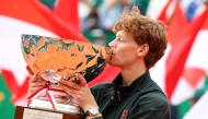 Italy's Jannik Sinner celebrates after winning the Monte Carlo ATP Masters Series Tournament final tennis match against Spain's Carlos Alcaraz on Court Rainier III at the Monte-Carlo Country Club in Roquebrune-Cap-Martin, south-eastern France on April 12, 2026. (Photo by Valery HACHE / AFP)