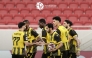 Qatar SC players celebrate a goal against Al Shamal.