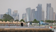 People visit the Corniche area of Doha on a cloudy day on April 9, 2026. (Photo by AFP)
