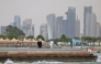 People visit the Corniche area of Doha on a cloudy day on April 9, 2026. (Photo by AFP)
