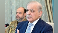 This handout photograph taken and released by Pakistan's Prime Minister Office on April 13, 2026 shows Pakistan's Prime Minister Shehbaz Sharif (R) attending a special meeting of the federal cabinet in Islamabad. (Photo by Pakistan's Prime Minister Office / AFP) 
