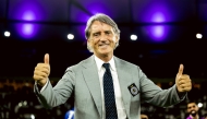 Roberto Mancini gestures after Al Sadd beat Al Hilal in the Round of 16 on Monday night. RIGHT: Al Sadd players celebrate their victory after penalty shootout. 