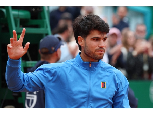 Spain's Carlos Alcaraz gestures after the Monte Carlo ATP Masters Series Tournament final tennis match against Italy's Jannik Sinner on Court Rainier III at the Monte-Carlo Country Club in Roquebrune-Cap-Martin, south-eastern France on April 12, 2026. (Photo by Valery HACHE / AFP)
